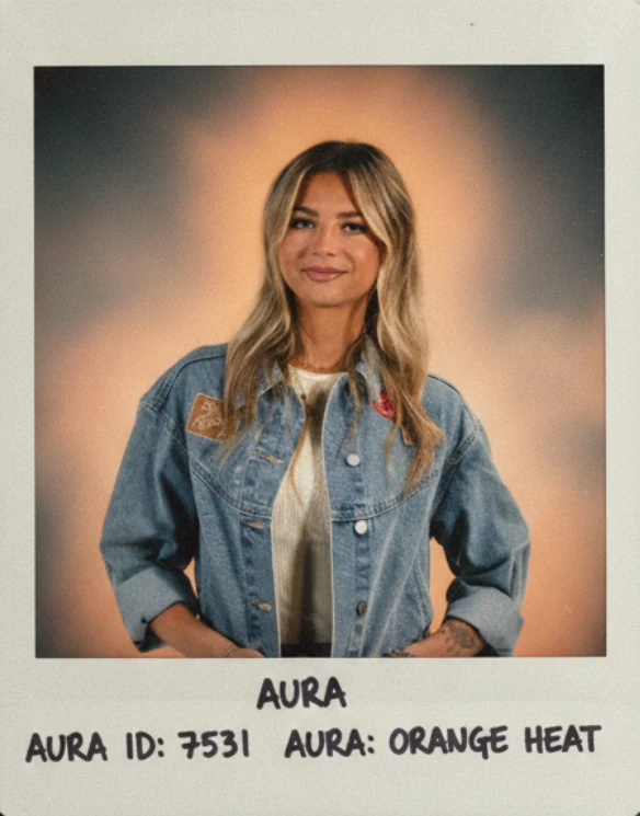 Jordan's aura photo: a polaroid print with an orange glow around her, labelled aura: orange heat